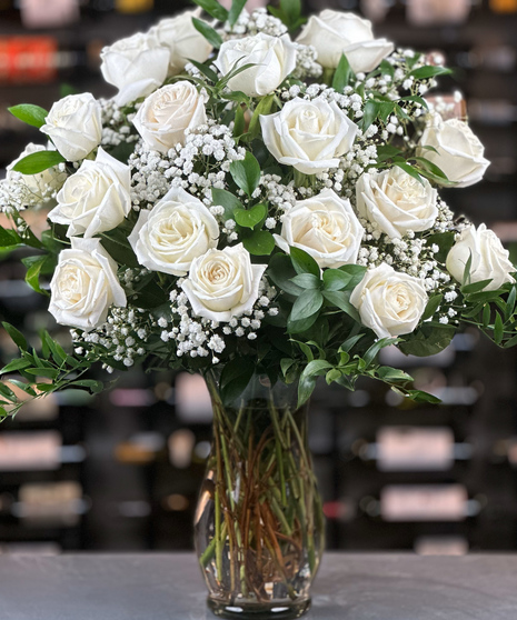 18 white roses with baby's breath delivered by columbus ohio florist Griffins Floral