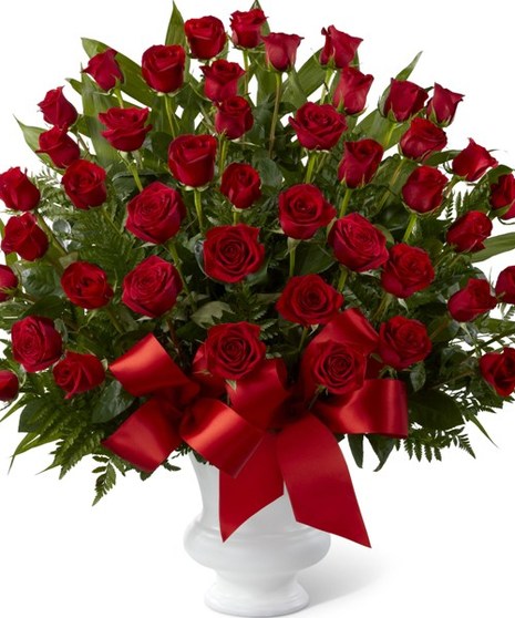 Dozens of ruby-red roses arranged in a classic urn will create an outstanding show of respect for a beloved friend, family member or business associate.