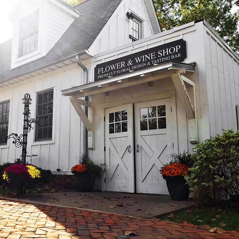 The barn door exterior of our Flower and Wine Shop